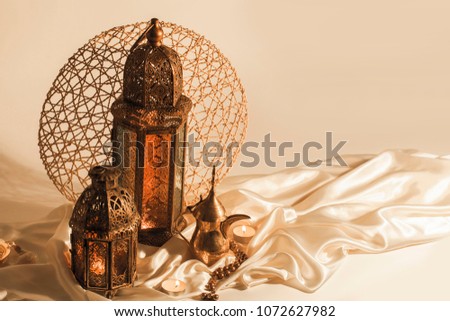 unique lantern with "dallah" Arabian coffee  on satin texture background