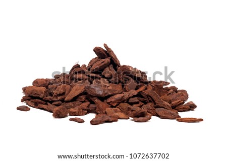 Shredded tree bark used for gardening isolated on a white background. Royalty-Free Stock Photo #1072637702