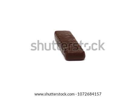 One cocoa chocolate candy on a white background, sweetness, isolate
