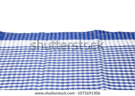 Checked napkin on white background. Kitchen towel. Blue tablecloth