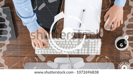 Digital composite of Hands using computer with overlays