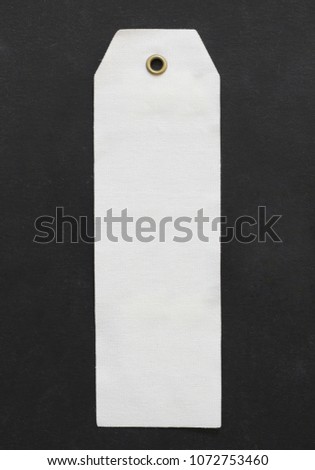 paper price tag on black paper background