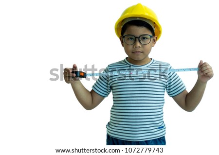 Asian handsome boy standing and wearing yellow helmet on white background. Kid model, construction worker and education concept for shooting photography.