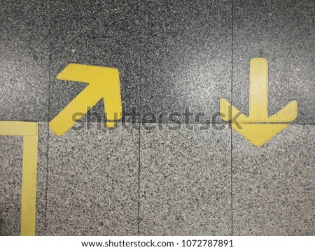 The remaining arrows show the directional signs on the walkway.