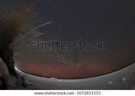 Milky way over the frozen lake Baikal.