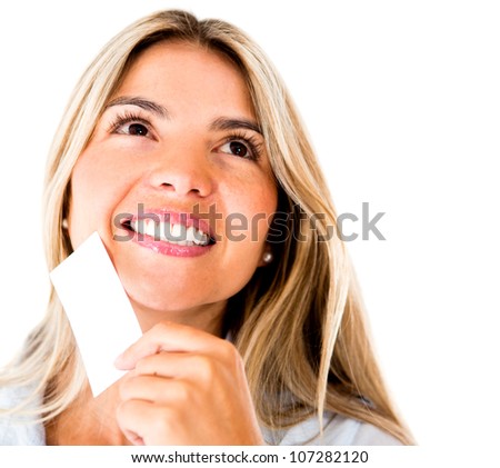 Pensive woman holding a business card - isolated over white background