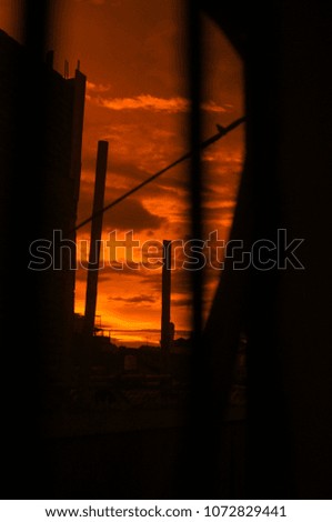Red Golden Sky on Dusk Hour with Silhouette of Power Pole at Bandung Indonesia
