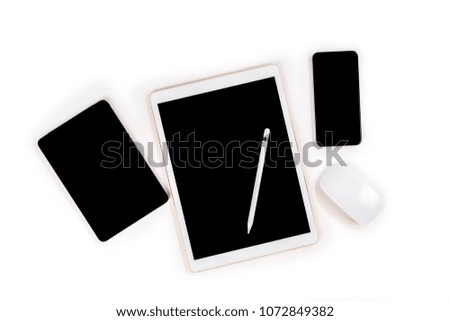 Office table with digital tablet, smartphone, mouse and pencil on isolated pure white background / Laptop and tablet mockup concept. (Selective Focus)