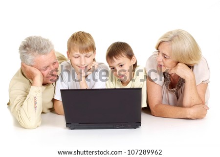 Grandparents with their adorable grandchildren on a white background
