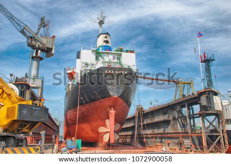 A Cargo Ship in Dry Dock Royalty-Free Stock Photo #1072900058