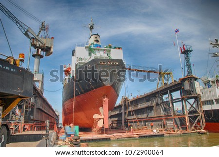 A Cargo Ship in Dry Dock Royalty-Free Stock Photo #1072900064