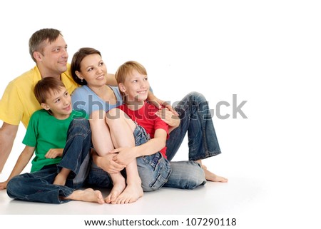 Pleasant family in bright T-shirts on a white background