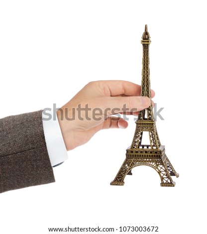Paris Eiffel tower souvenir in hand isolated on white background