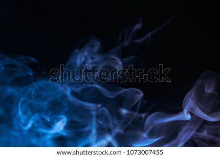 Colourful smoke on dark background