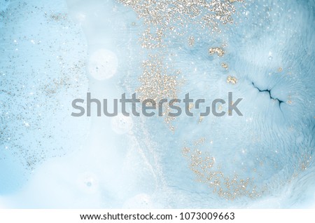 Abstract ocean- ART. Natural Luxury. Style incorporates the swirls of marble or the ripples of agate. Very beautiful blue paint with the addition of gold powder Royalty-Free Stock Photo #1073009663