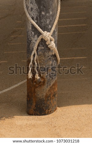 rope cord on the beach in the sand, background texture