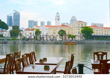 Scenic view of Singapore city in Boat Quay. One of the most popular places for waterside drink in Singapore. Royalty-Free Stock Photo #1073053490