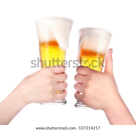 Pair of beer glasses with hand making a toast isolated on a white background