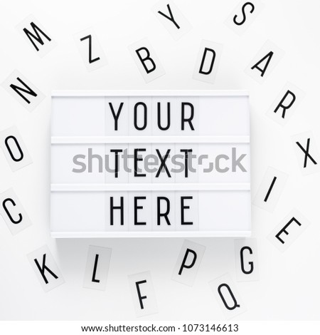 lightbox with words "your text here" and letters over white background