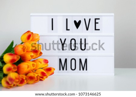 Mother's day - vintage lightbox with words "I love You mom" on the table