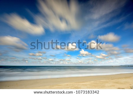 daytime long exposure beach seascape scene located at Terengganu Malaysia A slow shutter speed was used to see the movement ( Soft focus and grain effect )