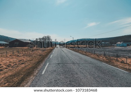 Northern Norway, straight road in the countryside in the north on a sunny day