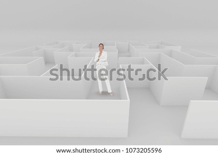 Happy woman standing in a maze