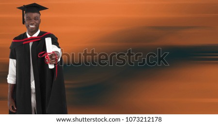 Graduate man smiling against blurry orange abstract background