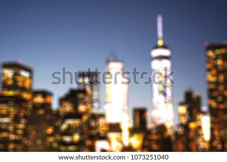 Defocused view of New York City skyline downtown from Brooklyn at evening