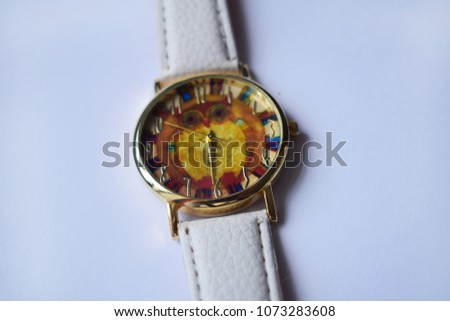 a clock with an owl on a white background