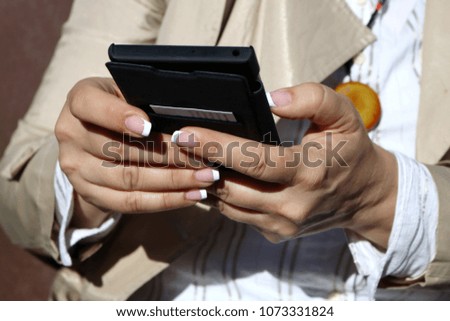     Woman Uses A Mobile Phone 