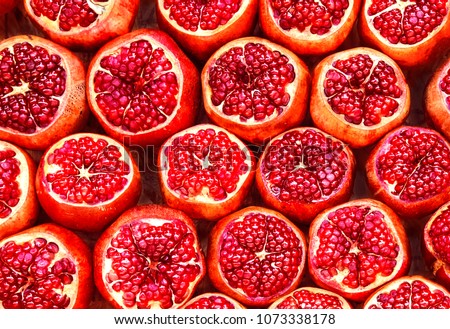 many pomegranate  cut in half, pomegranate background Royalty-Free Stock Photo #1073338178