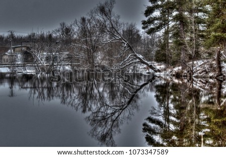 Scenic reflection on very still water in the Ottawa Valley, Ontario