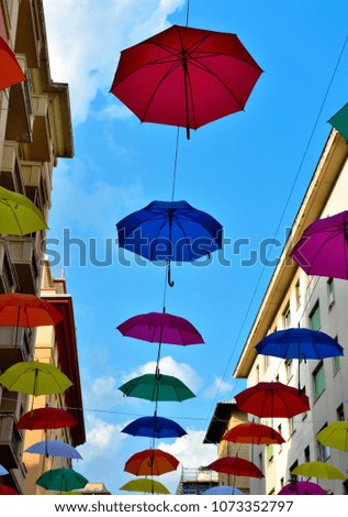 colorful umbrellas in the historic center of Genoa Italy