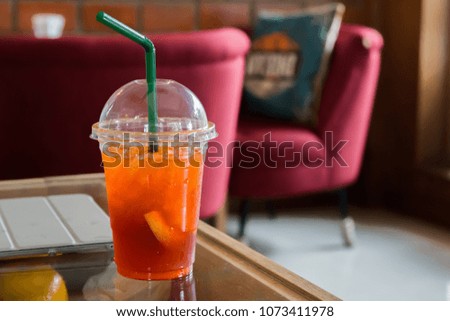 Cold Lemon Tea on the glass table in coffee shop.