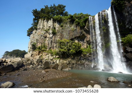 Jeongbang Falls is a popular tourist site on Jeju Island, South Korea.