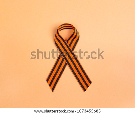 9 May background. St George's ribbon on orange background. 