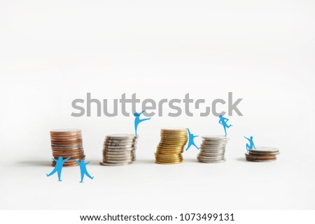 Background is foreign currency golden and silver ,Sorted into piles and rows.
Blue cartoon showing positive energy posture and empty top space for text. 
