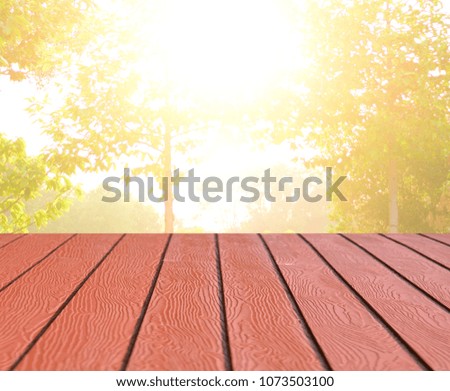 wood floor background with blurred tree