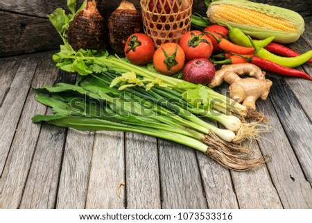 Organic vegetables on wooden table background. Healthy food background.