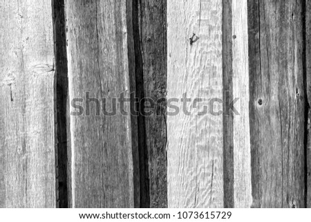 Old wooden fence pattern in black and white. Abstract background and texture for design.