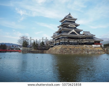 Japanese Castle by the canal typical landmark traveling in Japan sunny day vintage old architecture background 