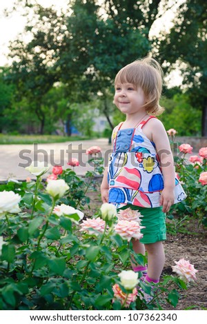little girl in the roses