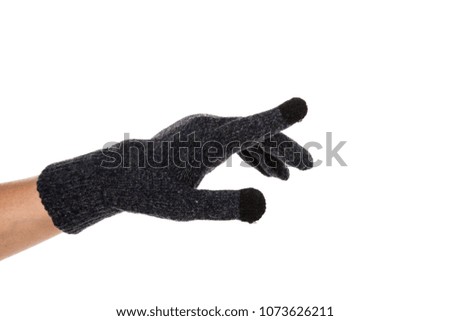 Side view of beautiful human hand palm dressed in new nice and soft natural wool fabric touch screen gloves isolated on abstract white background. Wearing and special clothes concept. Detailed closeup
