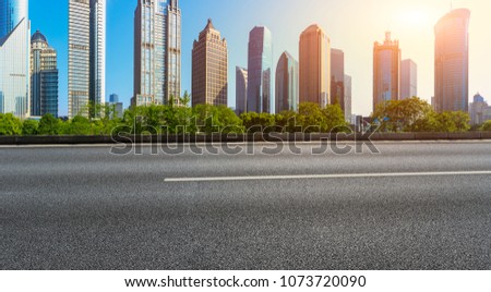 asphalt road with city skyline background in shanghai