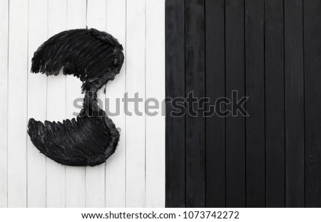 black angel wings black and white wooden background