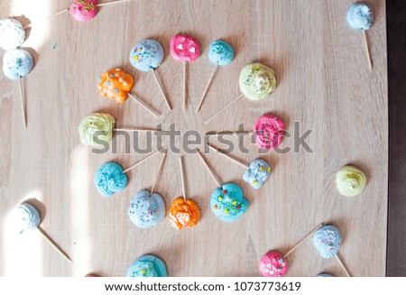 Master Class on cooking. meringue or french cookies of whipped egg whites and colorful sprinkles. merry time idea. vane concept with meringue. flat lay dessert background.