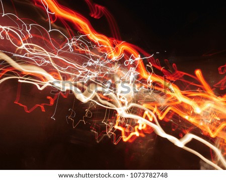 Abstract lighting transport with low speed shutter.