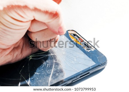 broken smartphone. Punch on the screen