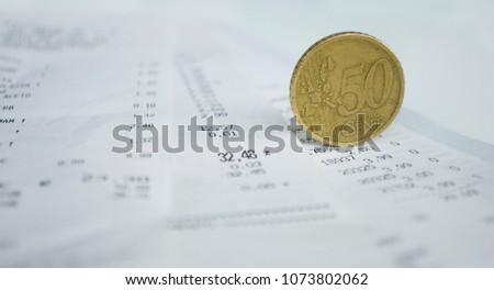 concept background: supermarket receipts, transaction made with card, detail of total spent in euro, 50 cents coin, home finances, sales, finance, Italy